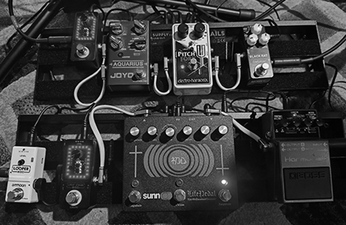 Two pedal chains consisting of eight guitar effects pedals