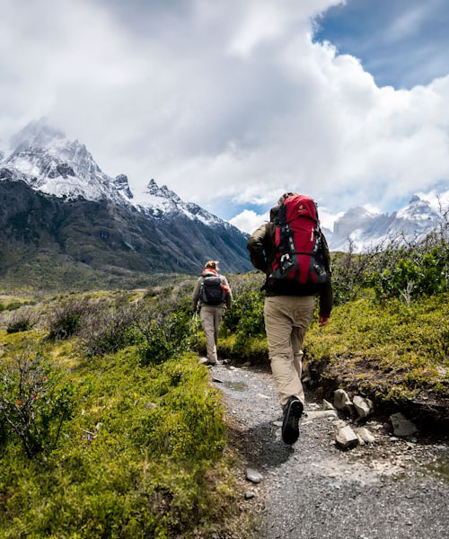 Hikers walking on mountain trail
