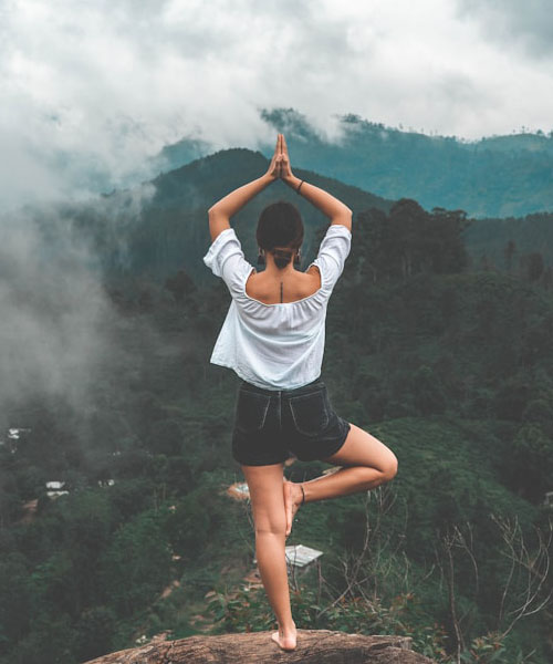 Person doing yoga outdoors