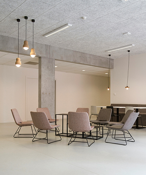 a clean, bright boardroom with 8 chairs