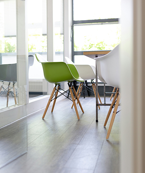 one green chair in a brightly lit room