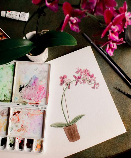 Close-up of painting tools with brushes and colorful paints