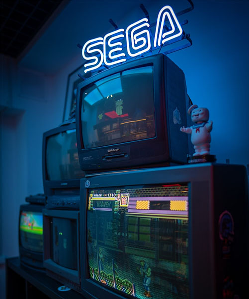 tv with sega games playing on them
